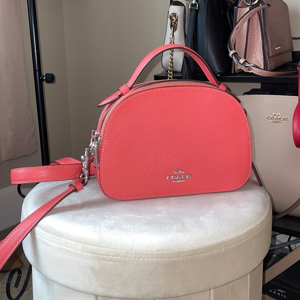 Used like new coral shoulder coach bag.